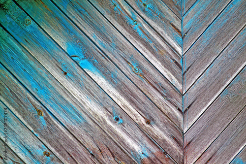 Старые выветрившиеся доски. Растрескавшаяся синяя краска. Background photo. Closeup of abstract texture.