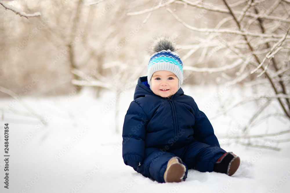 baby boy sitting on snow baby boy sitting on snow