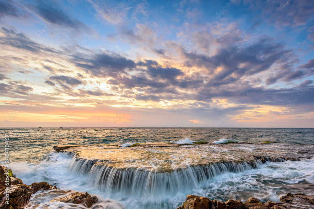 Fototapeta premium Sunrise on volcanic rock beach, Ninh Thuan province, Vietnam.