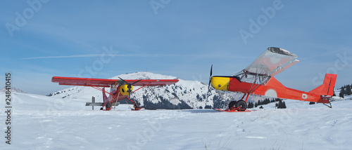 Monte Pora, Bergamo, Italy. A single engined, general aviation red light aircrafts parked on a snow covered plateau