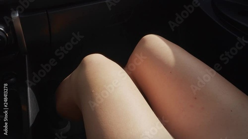 Male Hand Touching Female Leg in Car. Sexual Harassment in Transport Concept