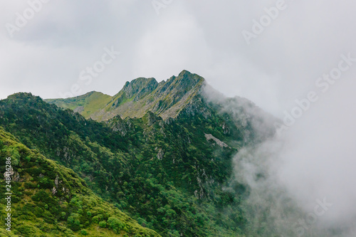 Mountain ridges covered by clouds and fog on top of Cangshan Mountains in Dali  Yunnan  China