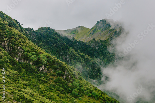 Mountain ridges covered by clouds and fog on top of Cangshan Mountains in Dali  Yunnan  China
