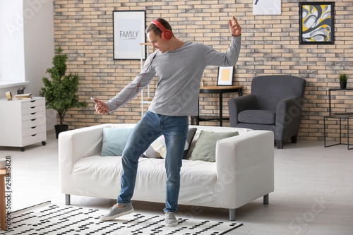 Handsome young man dancing ...