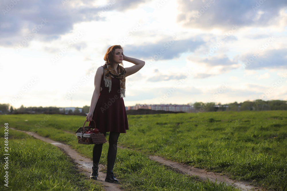 A girl in a hat on a walk in the park. A girl with a basket walks in the spring. A girl is walking along the road at sunset. A girl in a hat on a walk in the park. A girl with a basket walks in the spring. A girl is walking along the road at sunset.