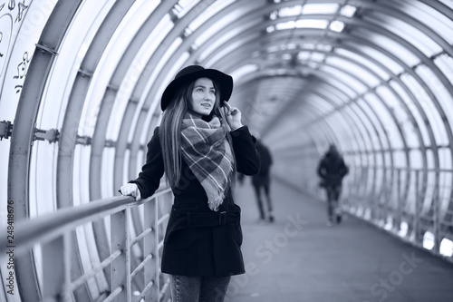 Young adult girl in the architectural tunnel