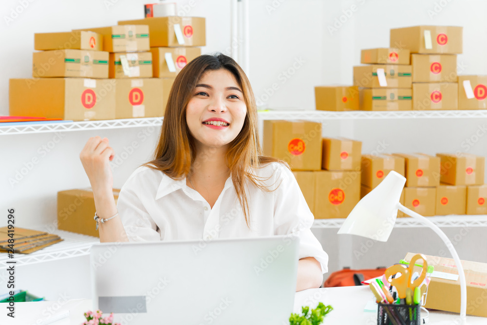 women working laptop computer from home on wooden floor with postal parcel, Selling online ideas concept, Women selling online start up small business owner working with using laptop women working laptop computer from home on wooden floor with postal parcel, Selling online ideas concept, Women selling online start up small business owner working with using laptop