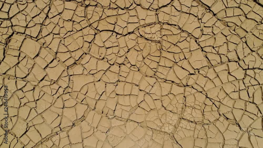 Arid desert with cracked earth filmed from above. 4K Aerial Video footage from Peru Arid desert with cracked earth filmed from above. 4K Aerial Video footage from Peru