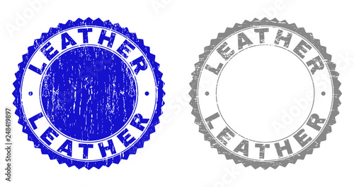 Grunge LEATHER stamp seals isolated on a white background. Rosette seals with grunge texture in blue and grey colors. Vector rubber stamp imprint of LEATHER caption inside round rosette.