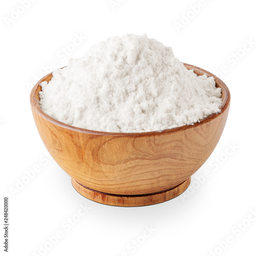 Bowl of wheat flour isolated on white background