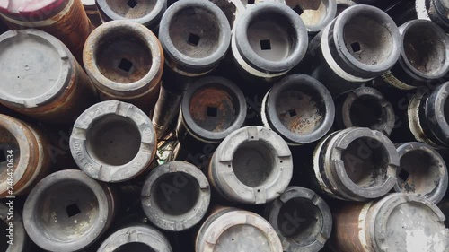 Stack of used drill pipe for oil and gas well drilling photo