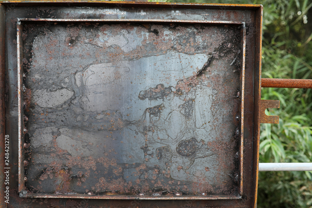The texture is metallic. Industrial background from an old rusty metal. Textured metal background with rust and cracks. The texture is metallic. Industrial background from an old rusty metal. Textured metal background with rust and cracks.