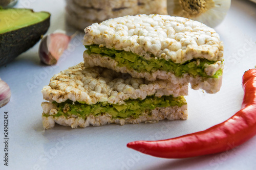 Rice cake with cream cheese and avocado.Vegan Food