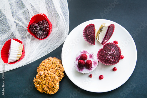 Valentines day desserts.Raw vegan mini cakes made with strawberries, cocoa butter, cashew and dates