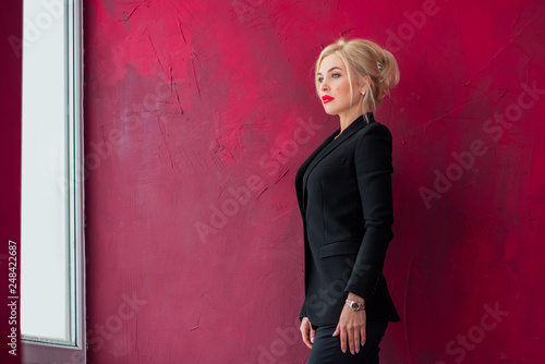 Business fashionable style for ladies. Clothes and fashion concept. Woman in black suit  © T.Den_Team