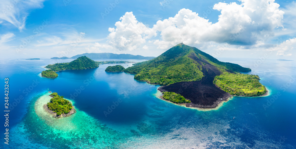 Aerial view Banda Islands Moluccas archipelago Indonesia, Pulau Gunung Api, lava flows, coral reef white sand beach. Top travel tourist destination, best diving snorkeling.