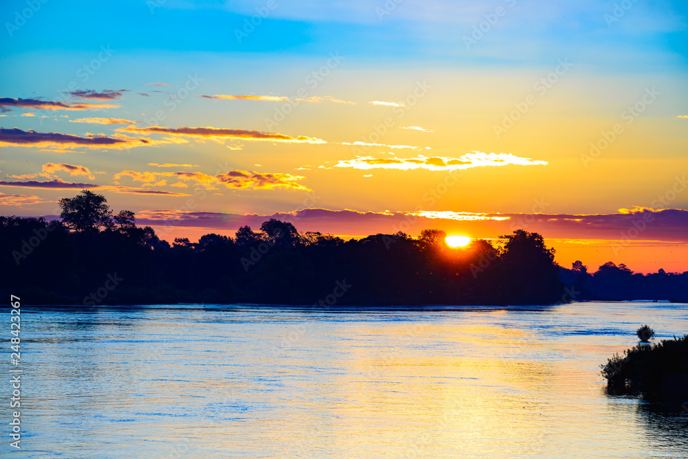 Fototapeta premium Mekong River 4000 islands Laos, sunrise dramatic sky, mist fog on water, famous travel destination backpacker in South East Asia