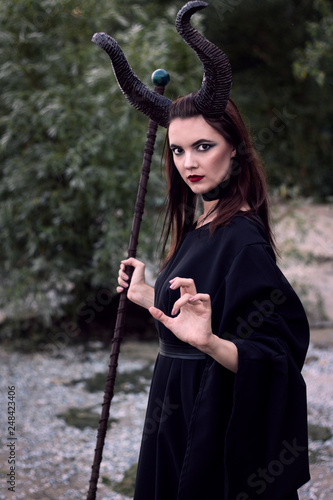 Valokuva Wicked Maleficent without wings with a staff
