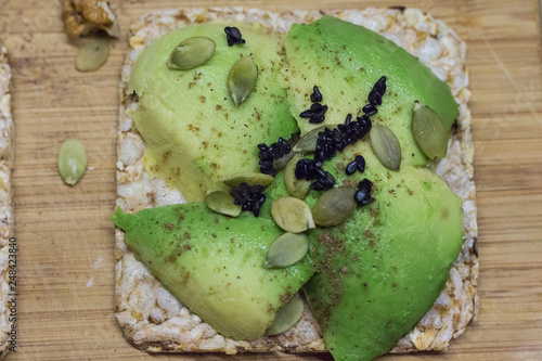 Bread with avocado, pumpkin seeds and black sesame. Healthy lifestyle.