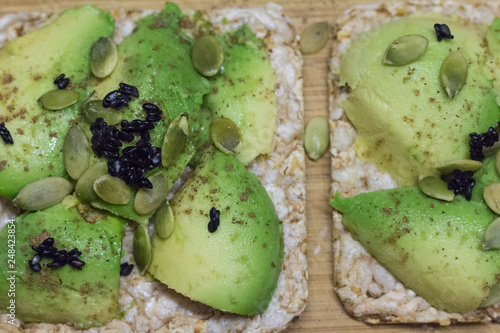 Bread with avocado, pumpkin seeds and black sesame. Healthy lifestyle.