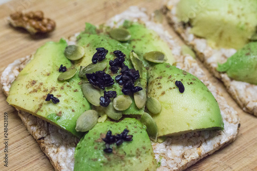 Bread with avocado, pumpkin seeds and black sesame. Healthy lifestyle.