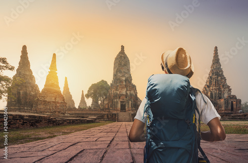 Young asian traveler with backpack in temple Ayuttaya, Thailand photo