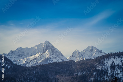 Panoramic view of the European Alps, dark, cloudy background concept