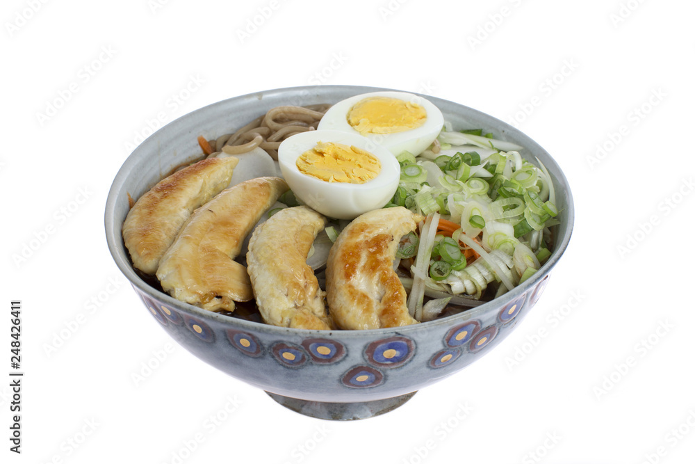 Ramen with chicken, eggs, vegetables and noodles on a white background Ramen with chicken, eggs, vegetables and noodles on a white background