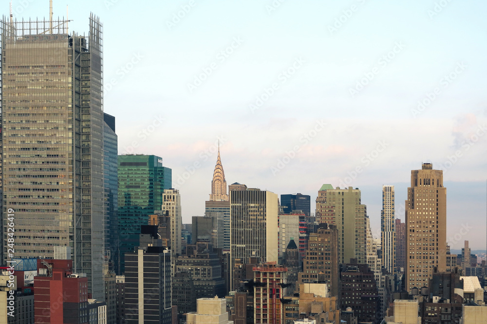 Aerial and panorama view of skyscrapers of New York City, Manhattan. Top view of night midtown of Manhattan. Aerial and panorama view of skyscrapers of New York City, Manhattan. Top view of night midtown of Manhattan.