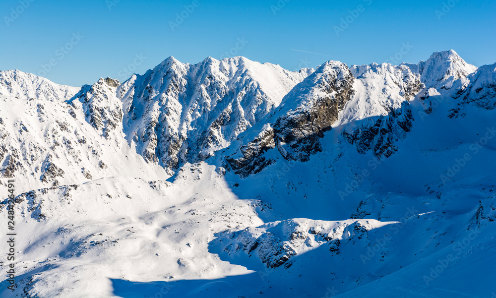 Fototapeta premium Mountains in a winter scenery. Natural landscape of the High Tatras.