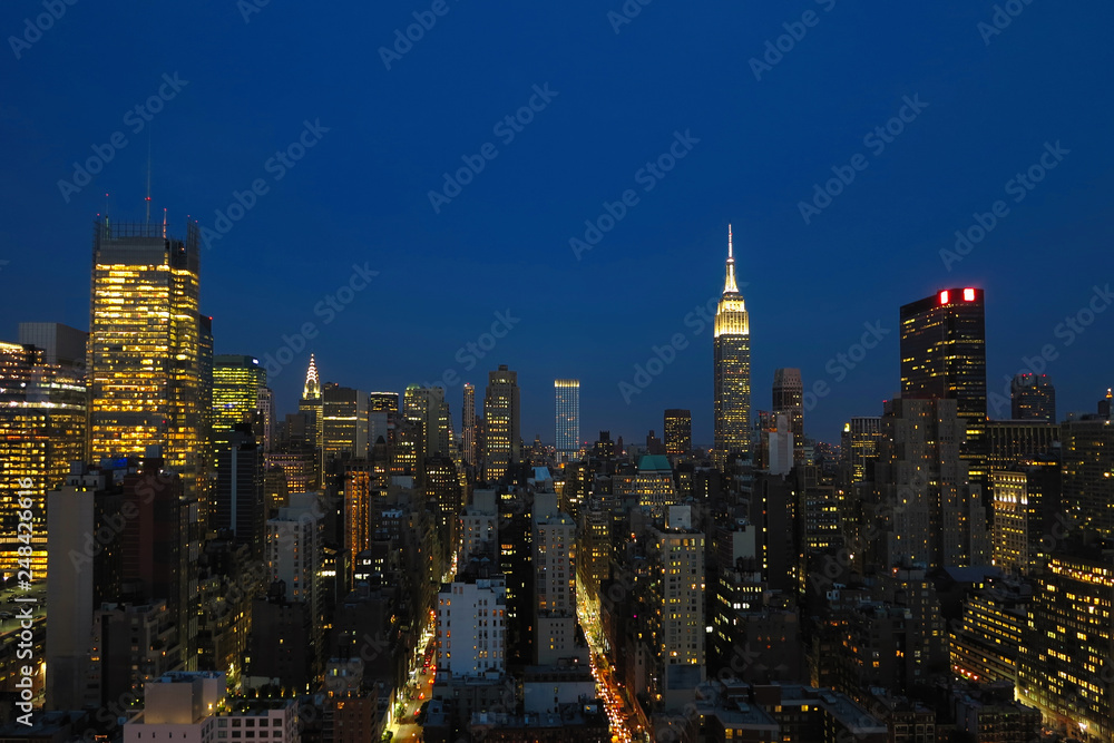 Obraz premium Aerial and panorama view of skyscrapers of New York City, Manhattan. Top view of night midtown of Manhattan