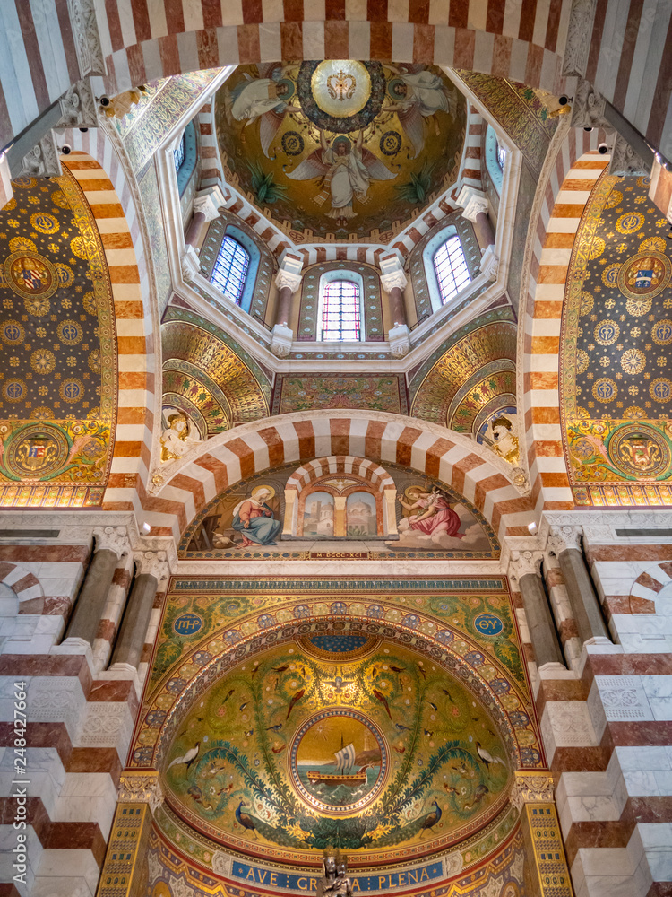 Notre-Dame de la Garde is a Catholic basilica in Marseille, France. The basilica consists of a lower church in the Romanesque style, and an upper church of Neo-Byzantine style decorated with mosaics.