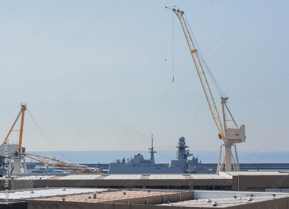 Genoa - Italy, an impressive crane during the loading phases in the port