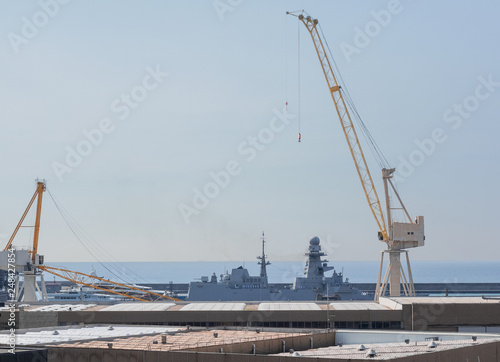 Genoa - Italy, an impressive crane during the loading phases in the port