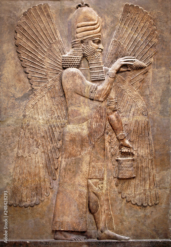 Obraz na płótnie Assyrian wall relief of a winged genius