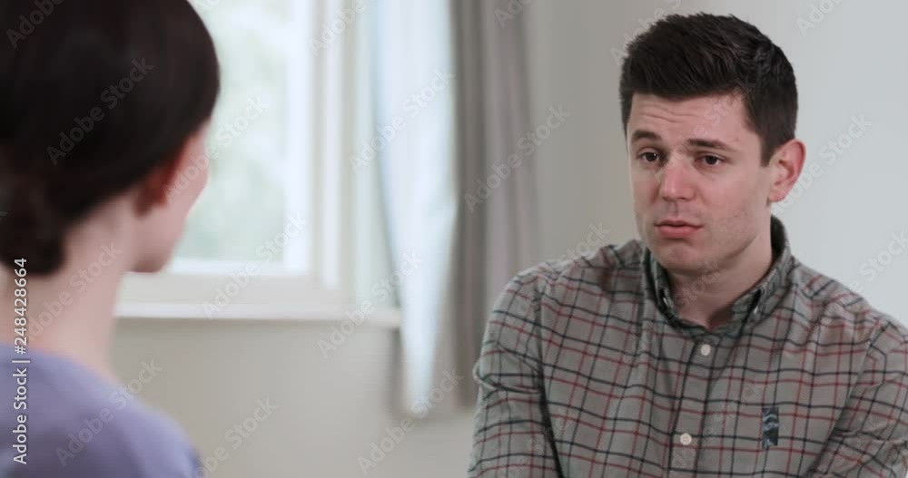 Depressed Man Talking To Female Counselor Depressed Man Talking To Female Counselor
