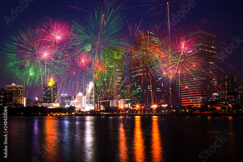 Photography The colorful fireworks on city, urban and lake in the night as beautiful backgro