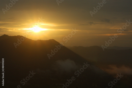 Beautiful sunrise and the mist on highland with mountain in Thailand © cocorattanakorn