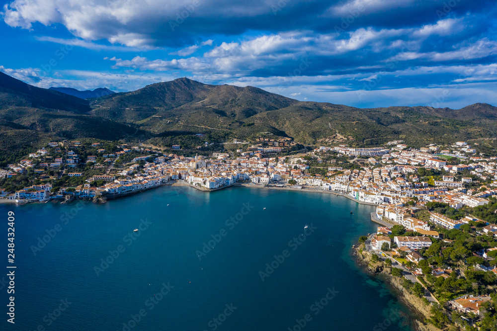 Aerial panoramic view of city Cadaques, sea and mountains, Beautiful Spanish small city by the sea. Drone photo of cityscape