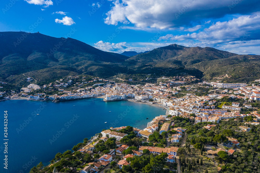 Aerial panoramic view of city Cadaques, sea and mountains, Beautiful Spanish small city by the sea. Drone photo of cityscape. Old Mediterranean town 
