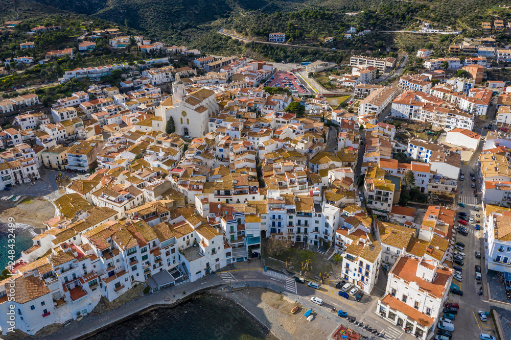 Lovely spanish town Cadaques. Aerial drone photo from above. Cozy white houses and narrow streets. City by the sea