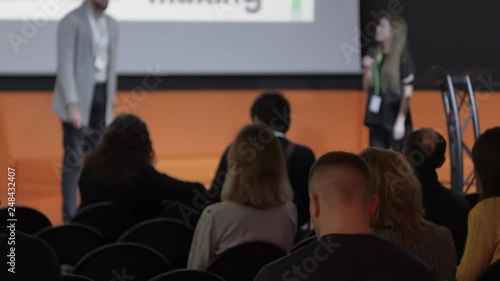 Wallpaper Mural female manager speaks something to the audience during business seminar or summit Torontodigital.ca