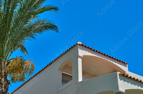 Hotel building with balcony on the sea