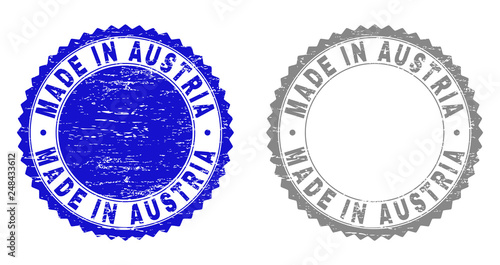 Grunge MADE IN AUSTRIA stamp seals isolated on a white background. Rosette seals with distress texture in blue and gray colors. Vector rubber watermark of MADE IN AUSTRIA caption inside round rosette.