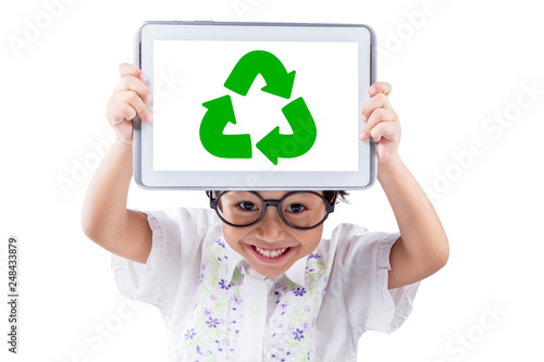 Little girl shows recycle symbol on the tablet