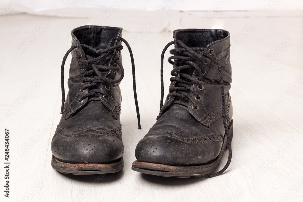 Pair of old leather black hipster boots Pair of old leather black hipster boots