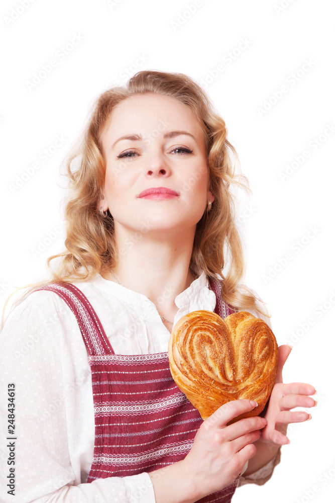 Portrait of cute smiling woman with bun in her hands.