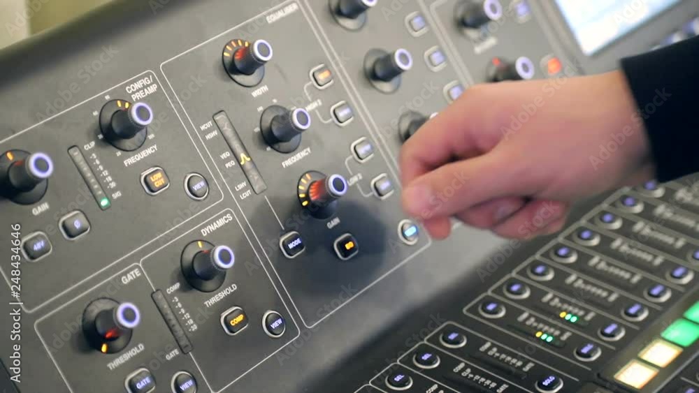 sound control for the Director's work. The hand of riser adjusts the settings of the audio panel sound control for the Director's work. The hand of riser adjusts the settings of the audio panel