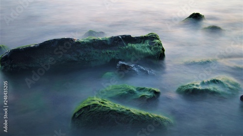 green stones in sea water