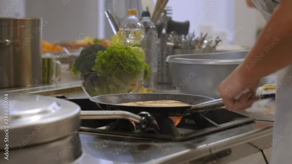 making pancakes in professional kitchen making pancakes in professional kitchen